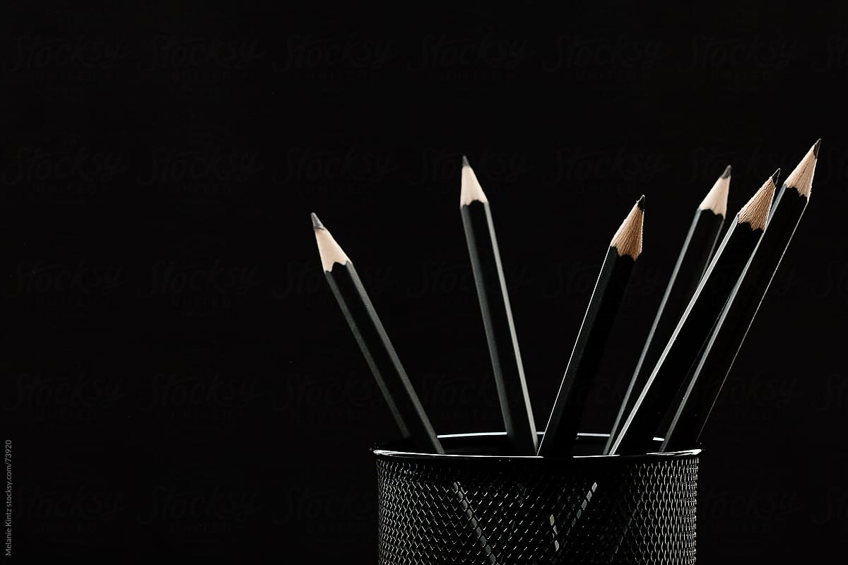 Group Of Black Pencils In A Black Holder Before Black Background by  Stocksy Contributor Melanie Kintz - Stocksy