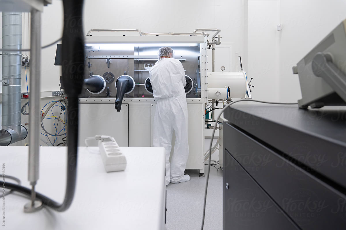 Researcher Working At Glovebox In Clean Room
