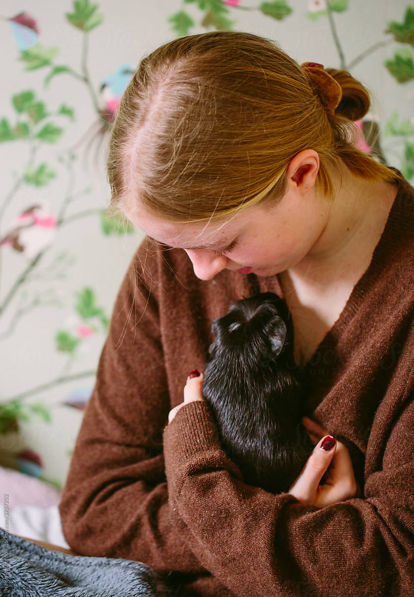 Teenage girl and pet guinea pigs