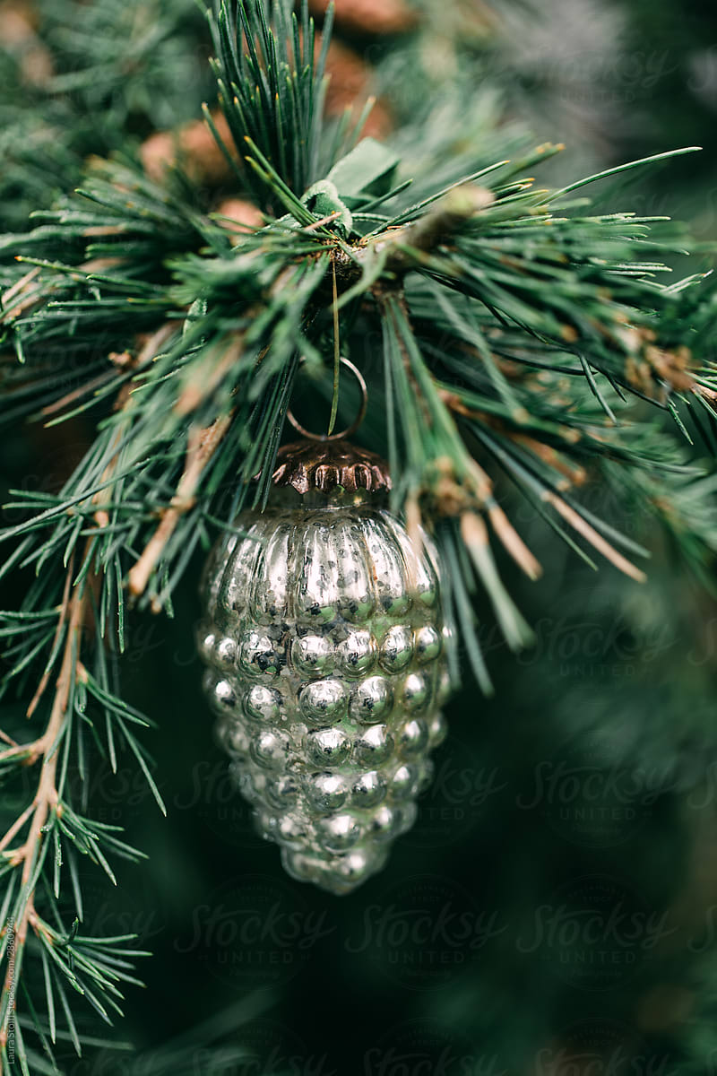 Vintage pine shaped Christmas decoration on tree
