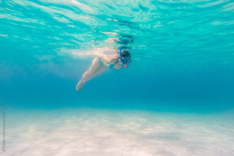 Woman Diving Underwater at All Inclusive Caribbean Resort White Sand Beach