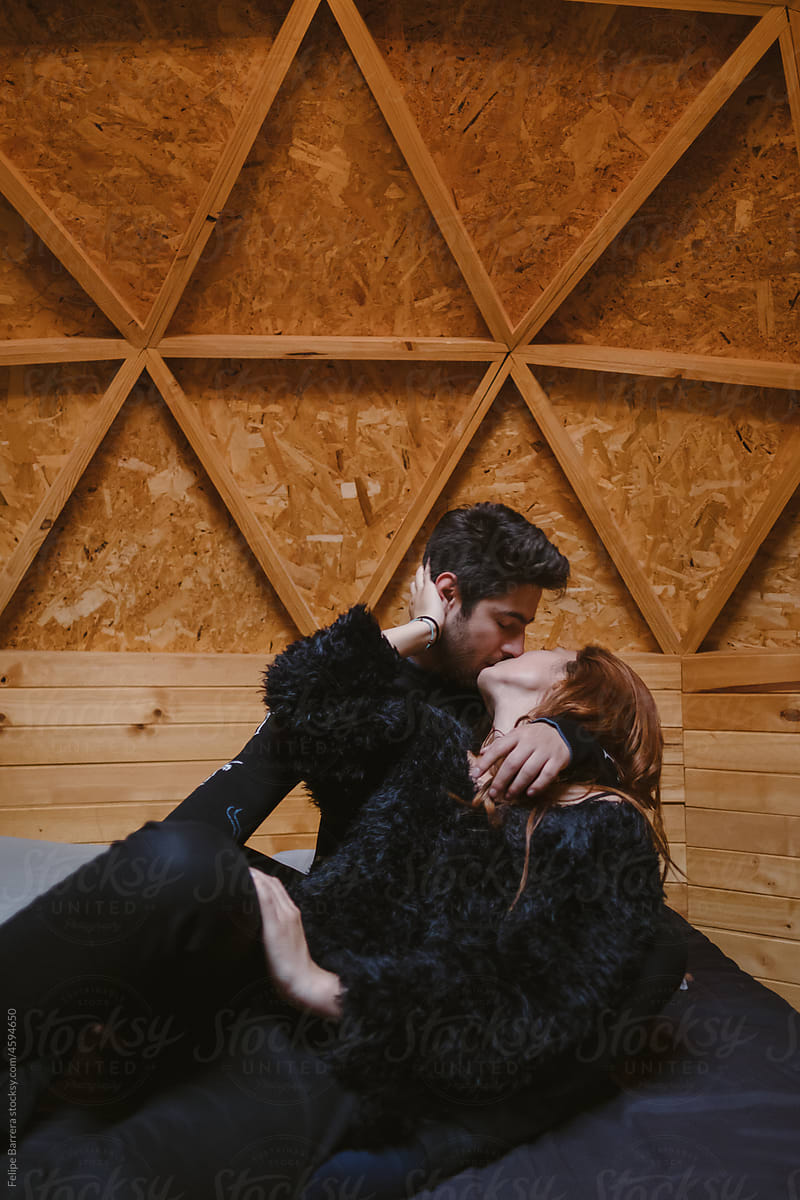 Beautiful couple kiss in a glamping