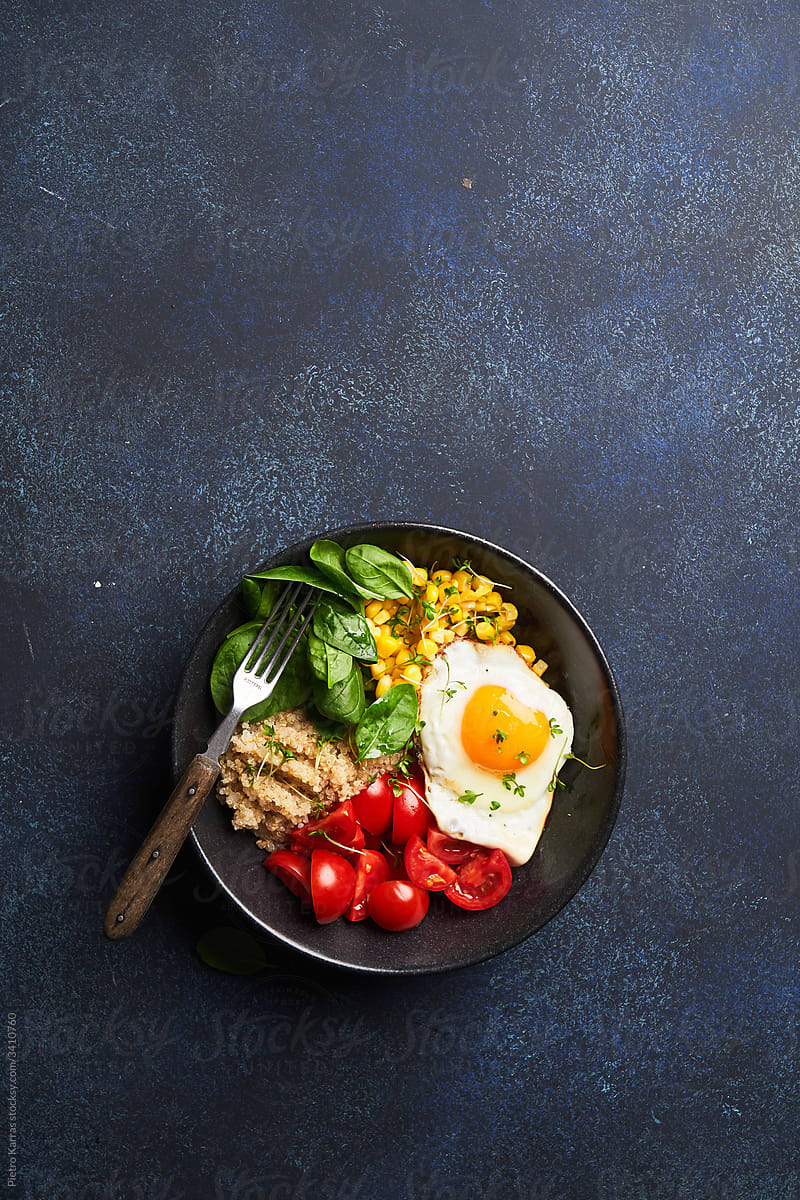 Tasty fried egg and vegetables on plate
