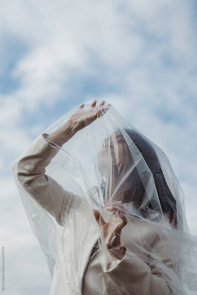 Asian woman In Nature Covered With Plastic. Isolation