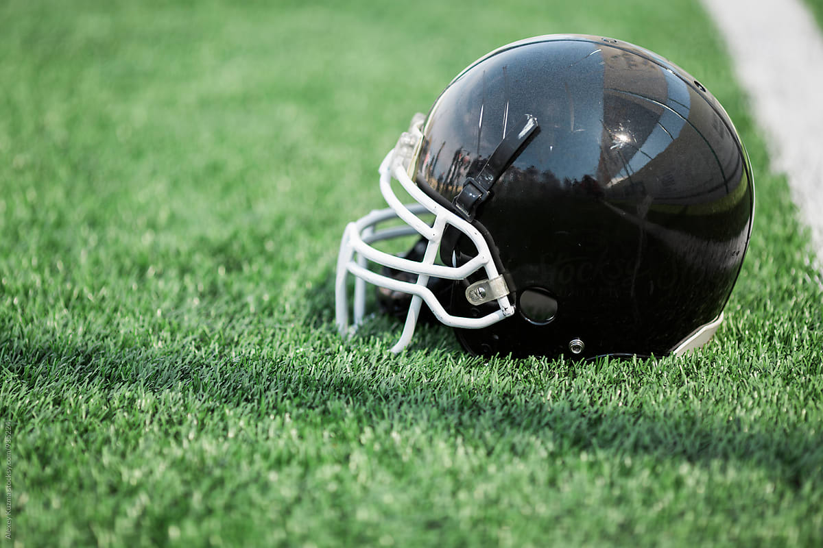 American football helmet on the grass