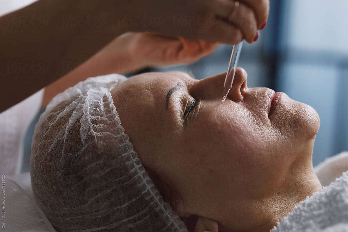 Woman doing anti aging therapy for skin.