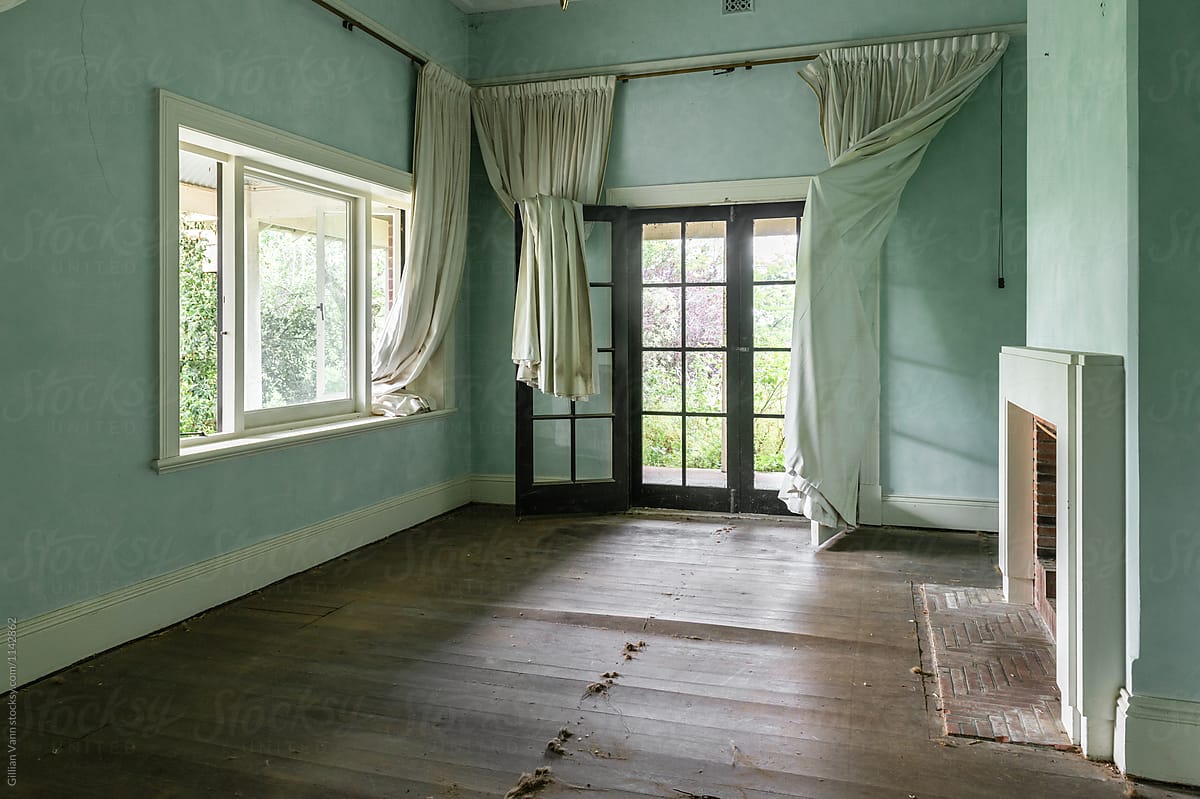 house interior before a renovation, with bowed timber floors