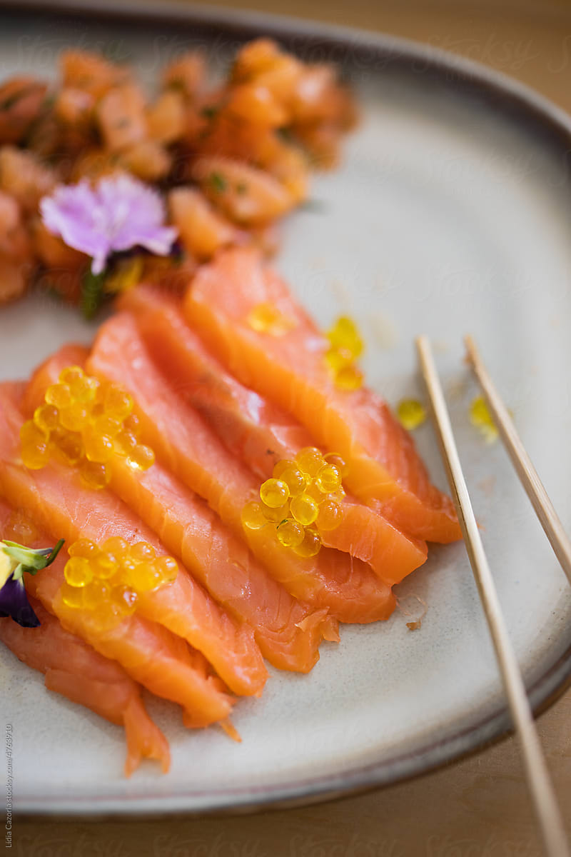 Plate of salmon with some flowers