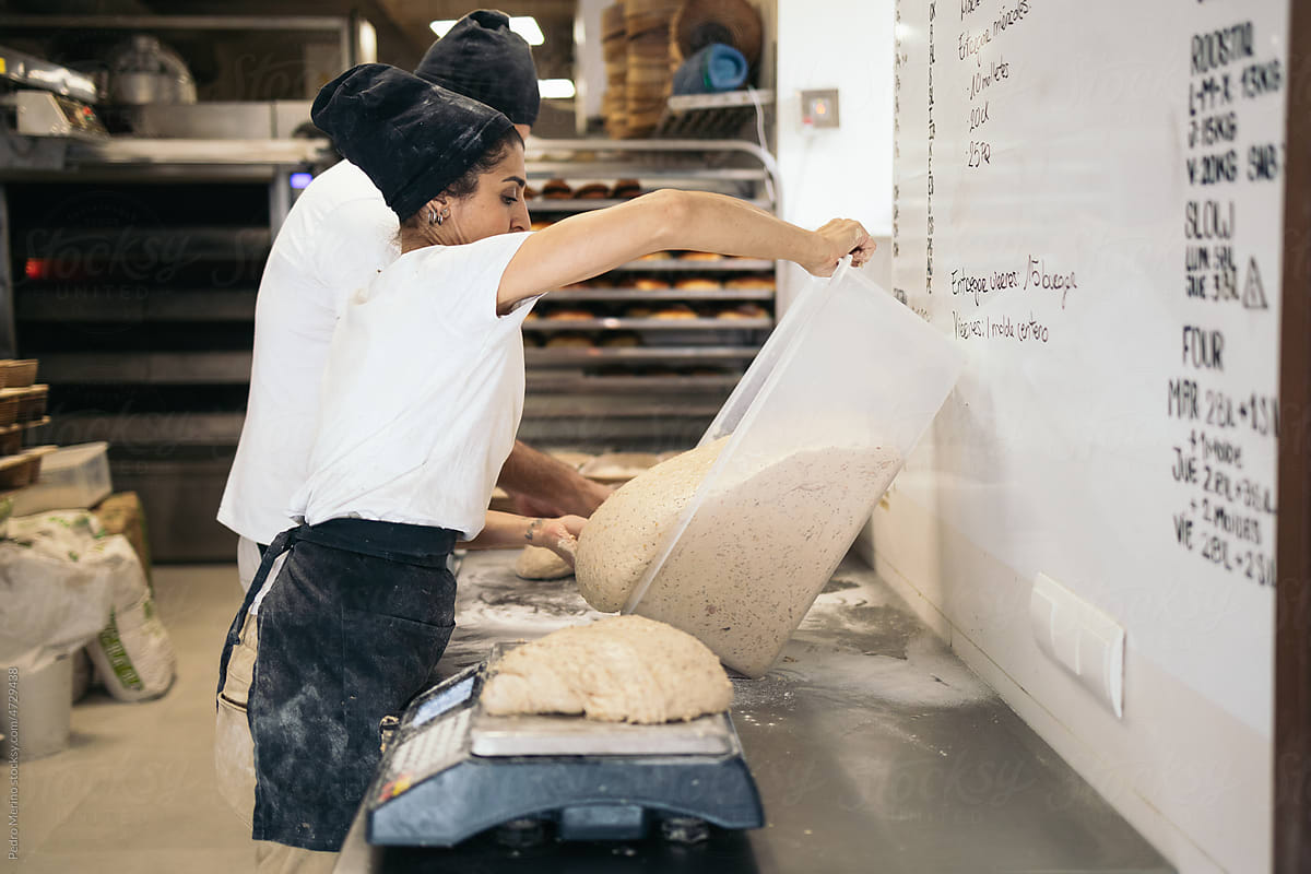 Baker Preparing The Dough For The Bread Making
