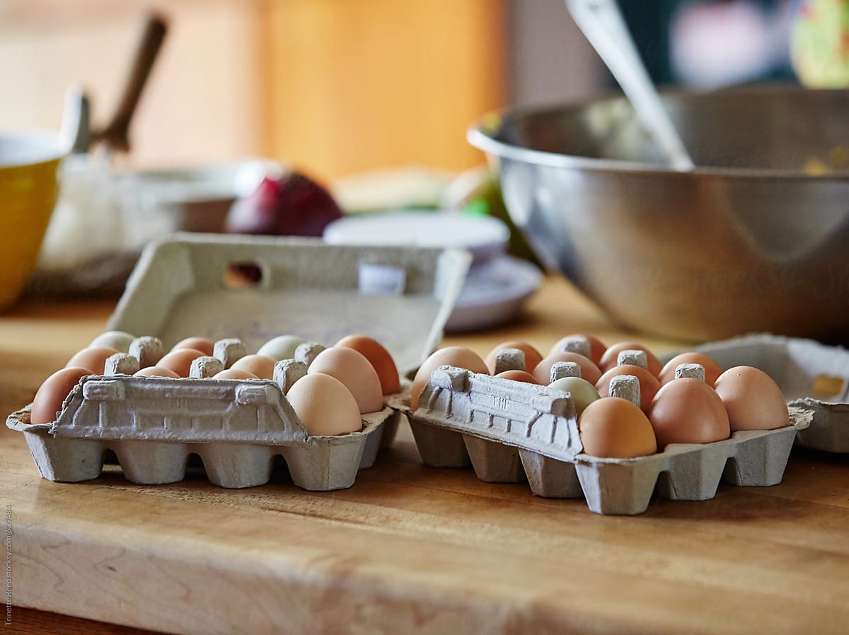 Farm fresh eggs in carton on kitchen countertop