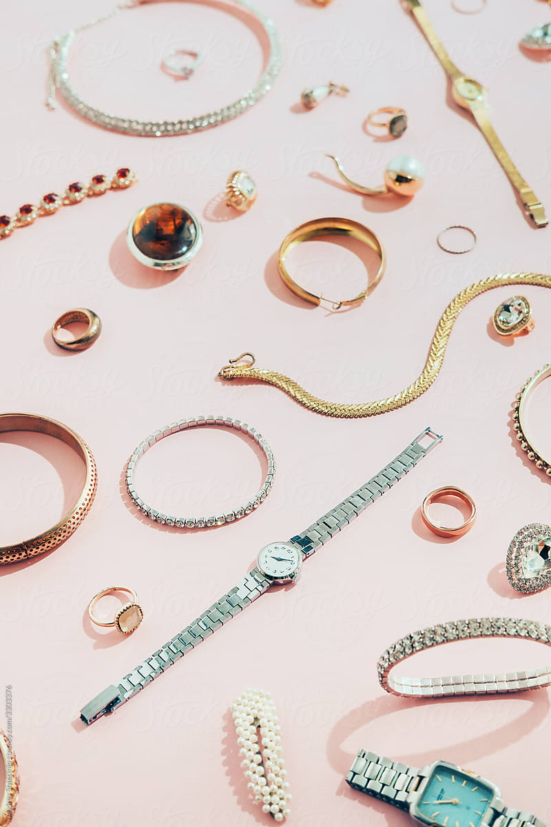 Jewellery,diamonds, ruby, gold, silver  etc/ on pink background