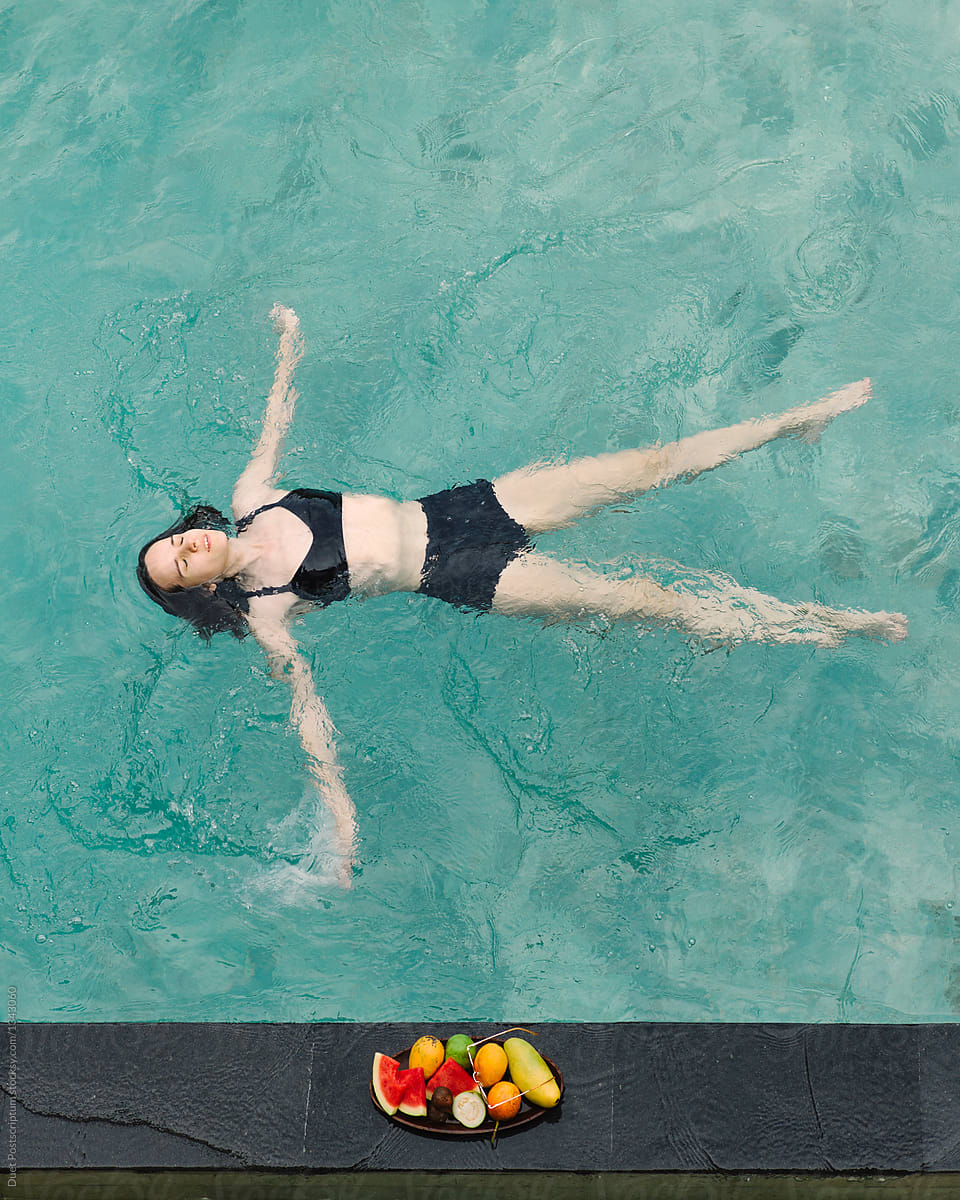 Woman Relaxing In Pool By Stocksy Contributor Duet Postscriptum Stocksy
