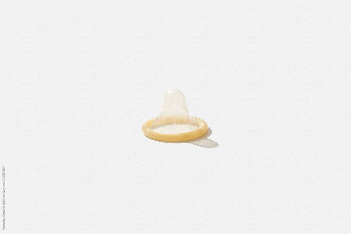 Single condom on white background.