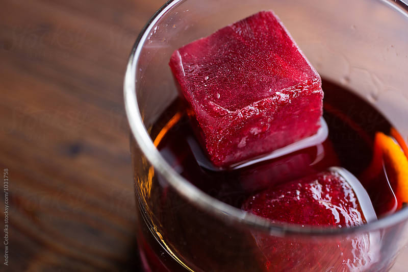 Liquor with frozen juice ice cubes