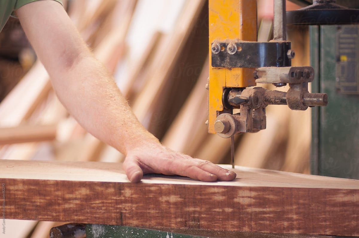 Close-up detail of a carpenter using a power saw
