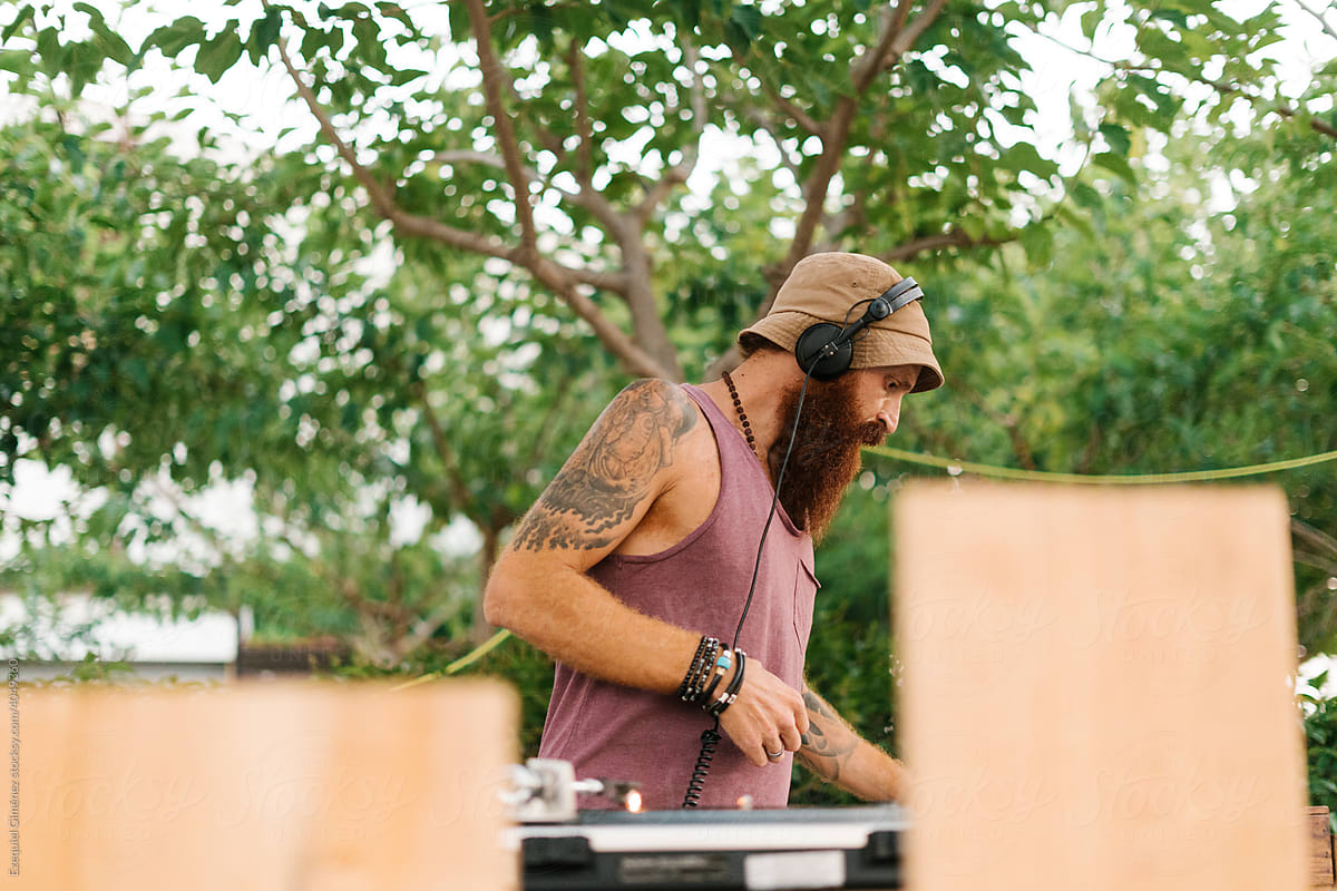 Man playing electronic music in park