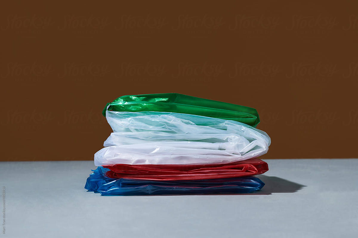 Piles of colorful plastic bags that are folded , Fold plastic bags