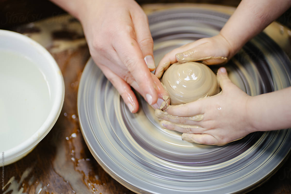 Little child is engaged in pottery