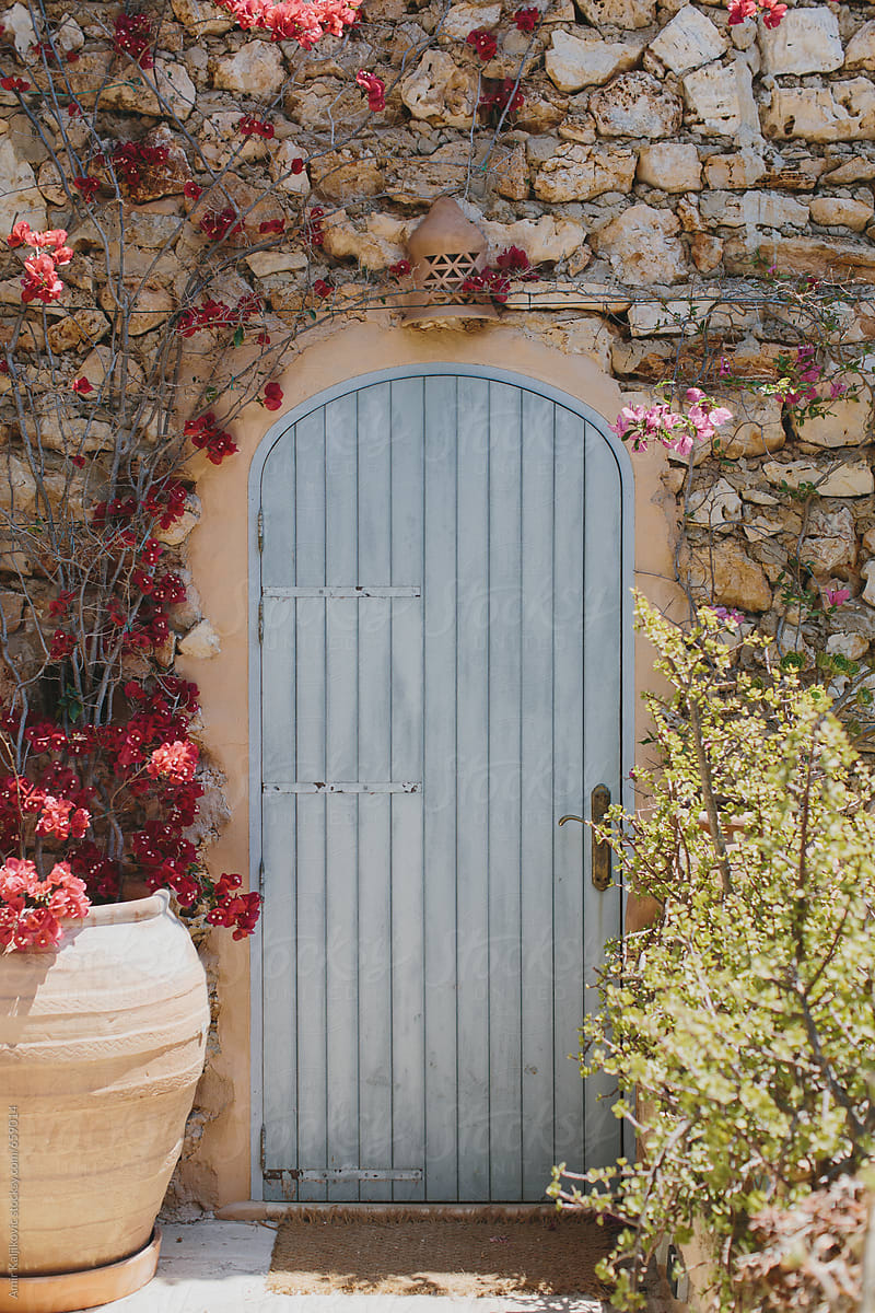 Old wooden door in a stone wall