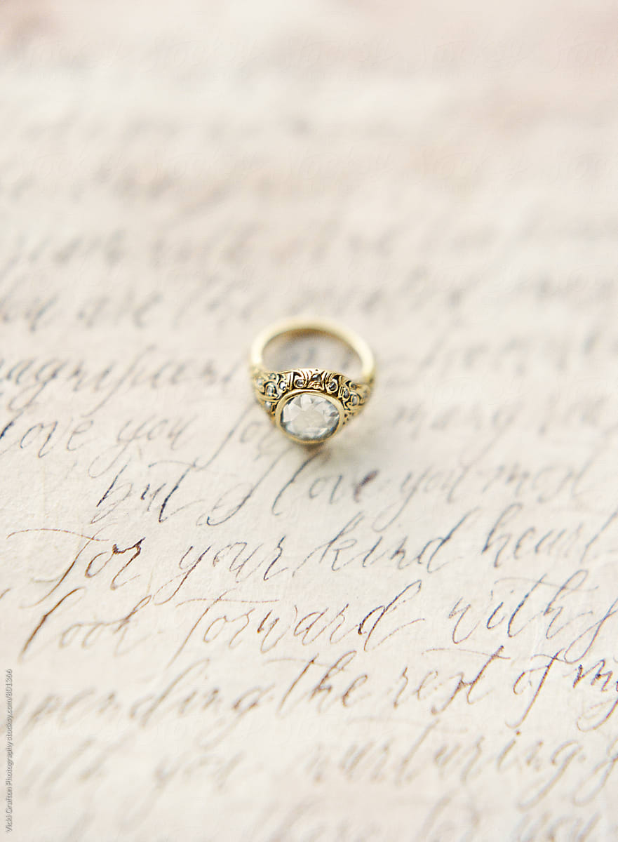 Vintage engagement ring and calligraphy vows