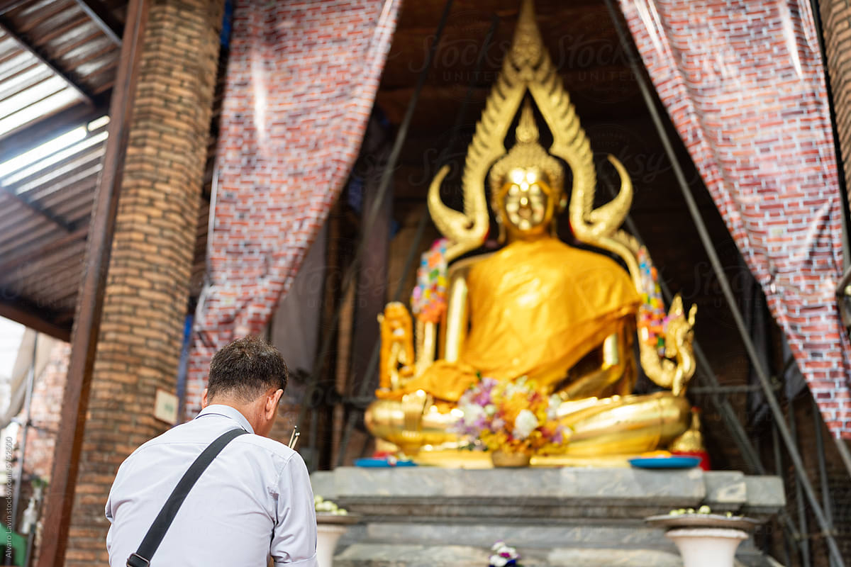 Man praying in a temple.