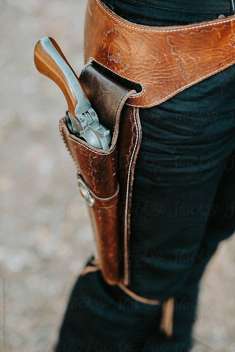 close up of a cowboy wearing gun