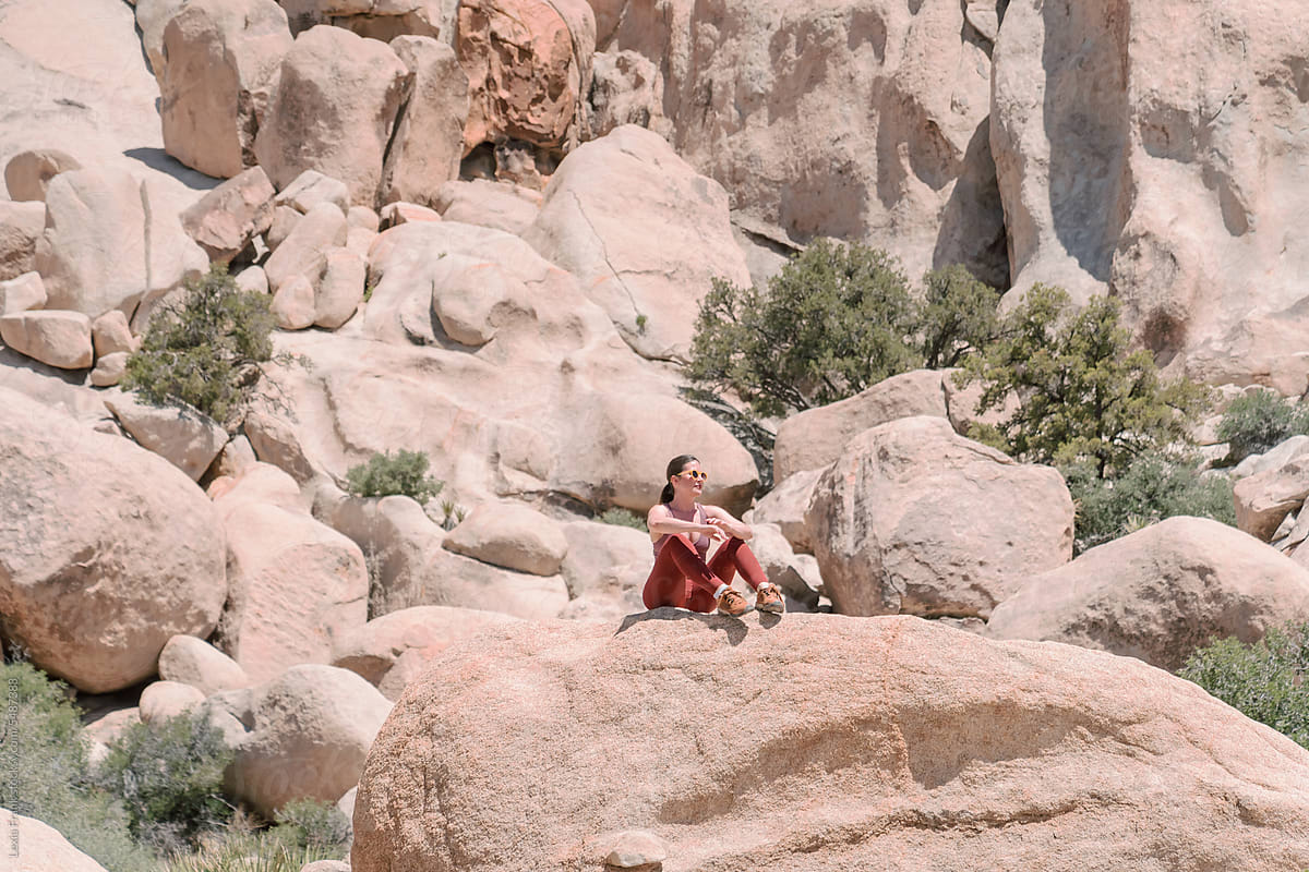 woman resting on desert hike