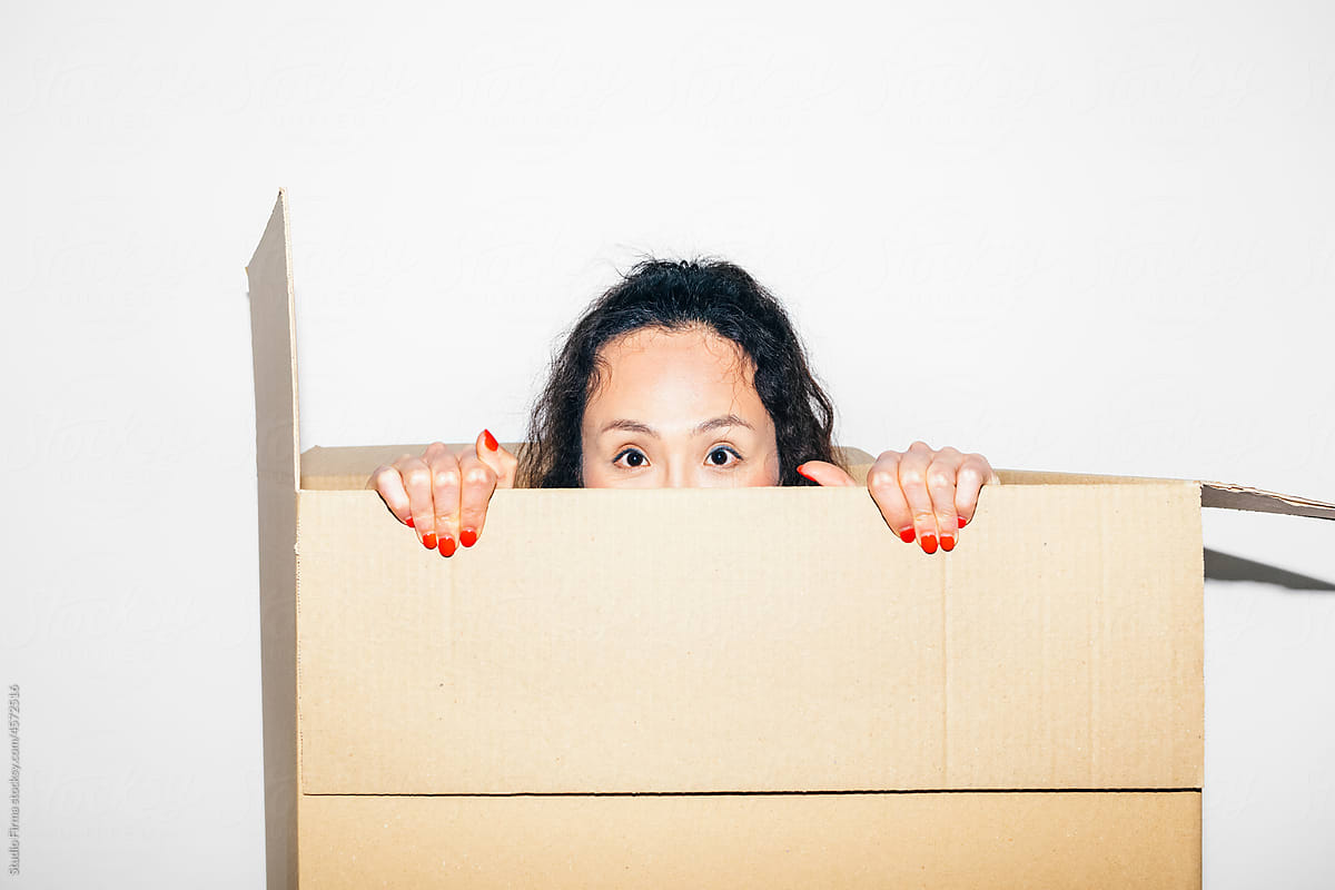 Asian Woman Peeking Out of Box