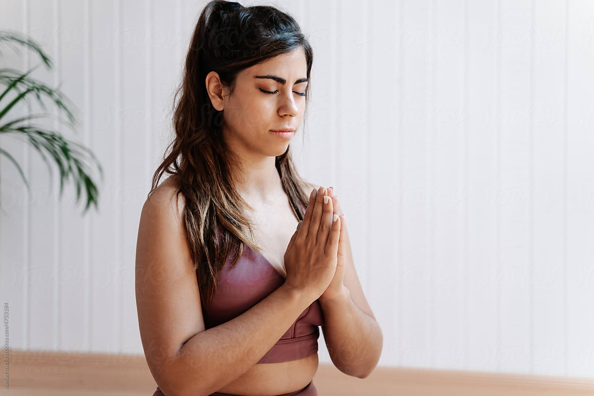 Sporty woman meditating during yoga training