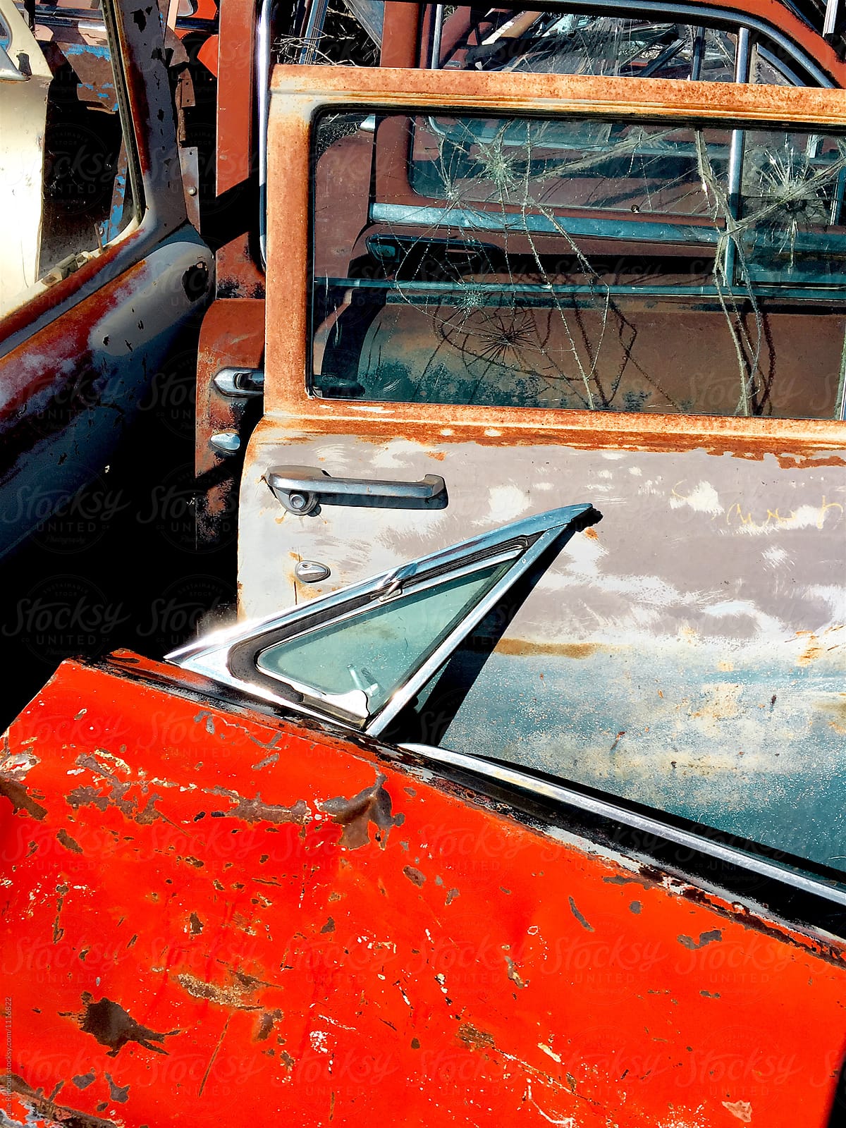 Old car doors at a junkyard