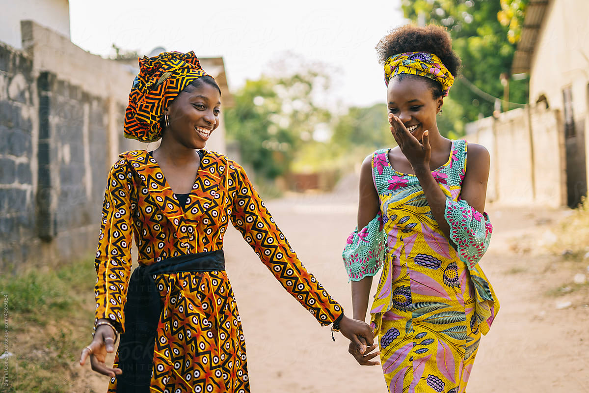 Laughing African girlfriends in village