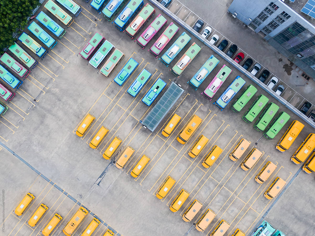Top-down aerial view into a bus depot