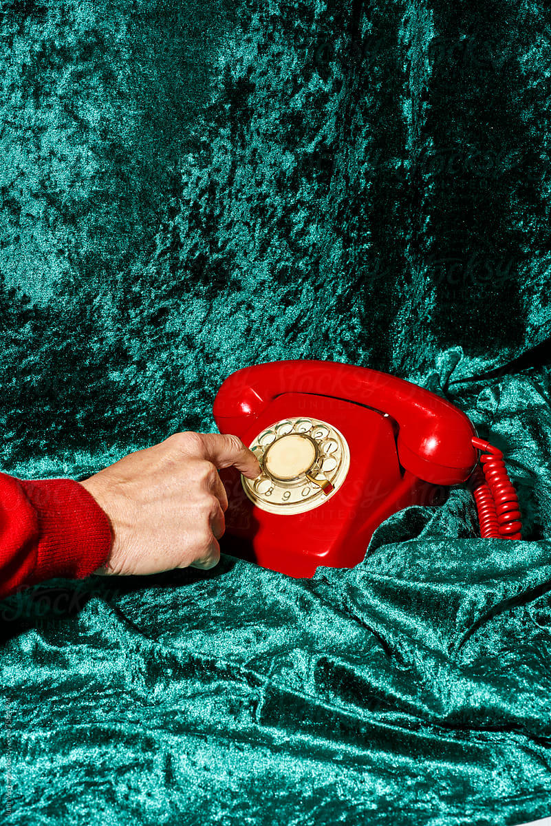 dialing on a red telephone