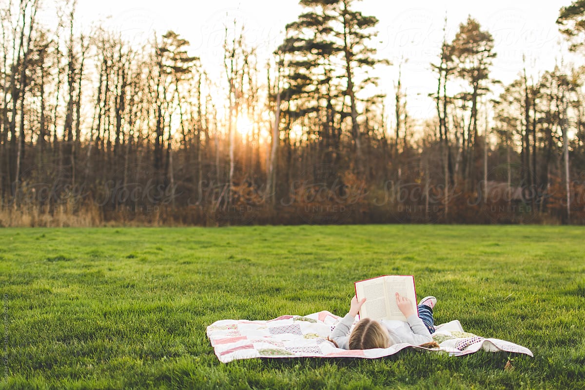 Girl reading in a field