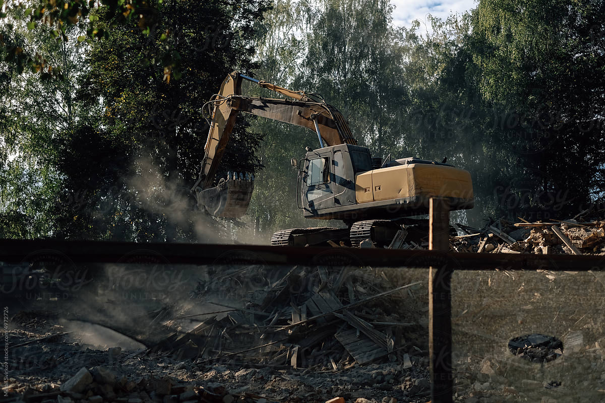 Demolition of an old house with an excavator