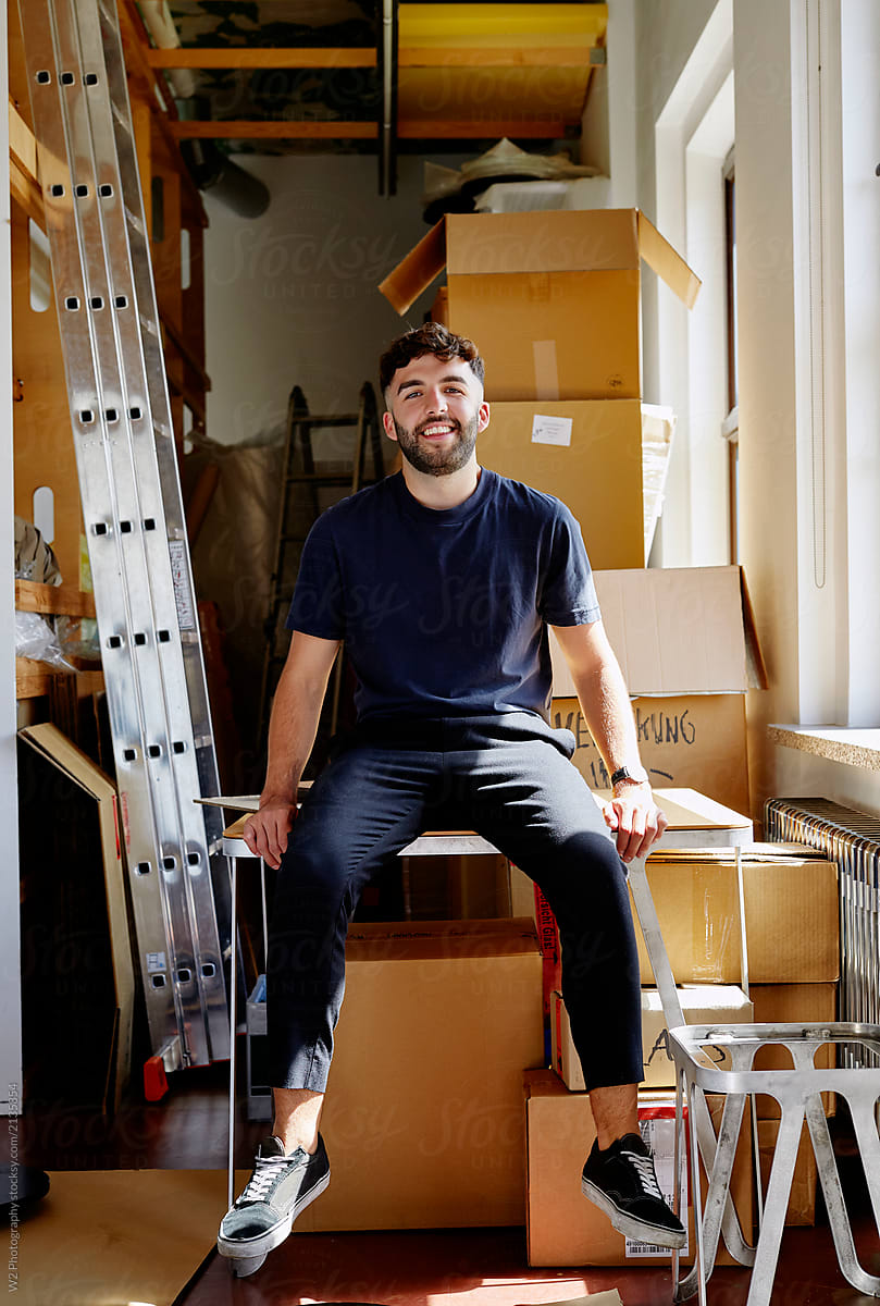 Approachable  man in a loft storage room