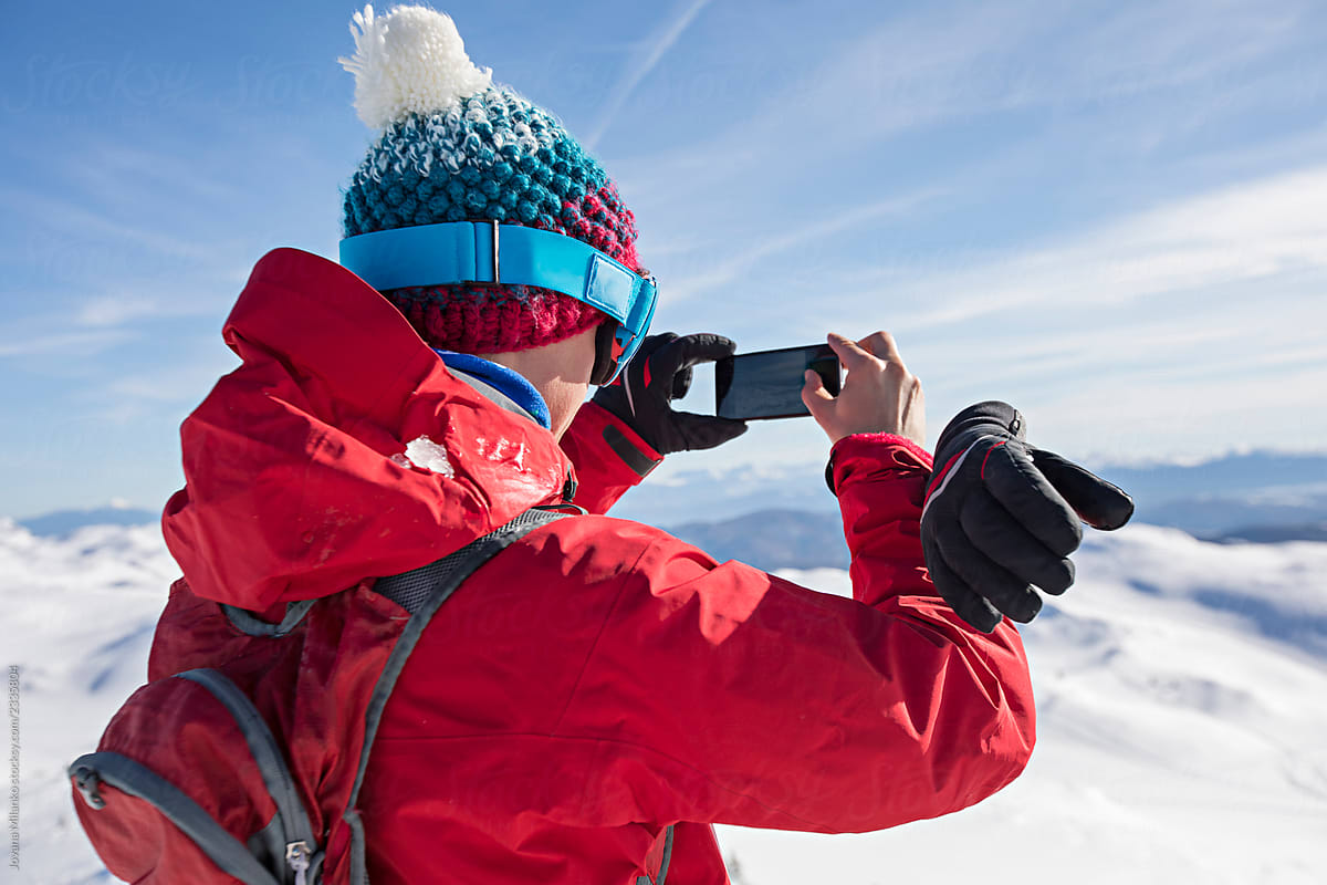 Man taking a photo in winter
