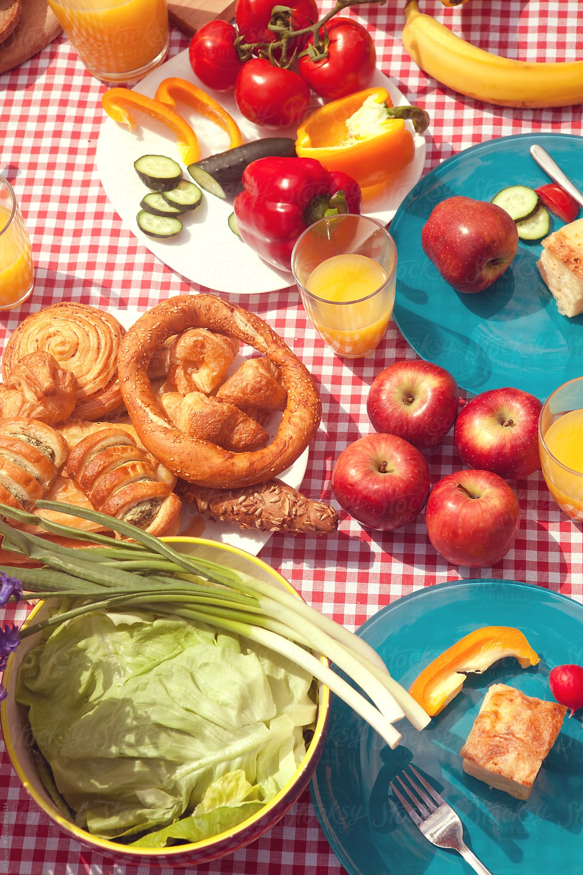 Table full of colorful breakfast picnic food.