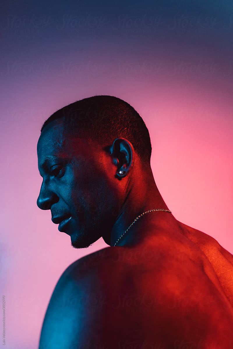Portrait Of A Man Under Blue And Red Lights