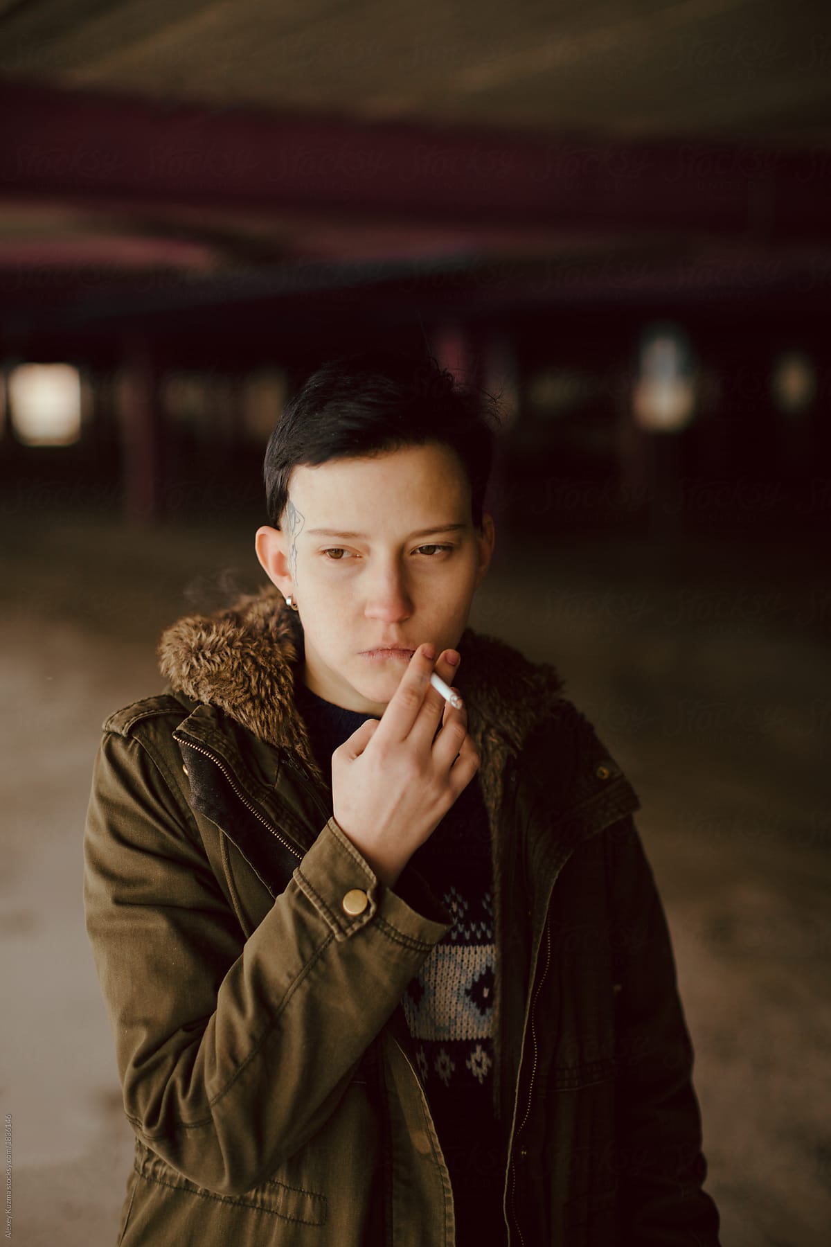 Real Lesbian Girl Smoking On The Parking Area Del Colaborador De Stocksy Alexey Kuzma Stocksy