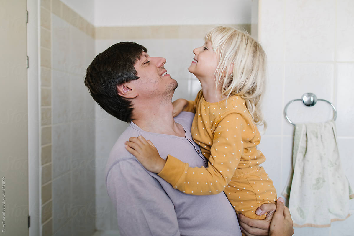 Daughter and father in a bathroom