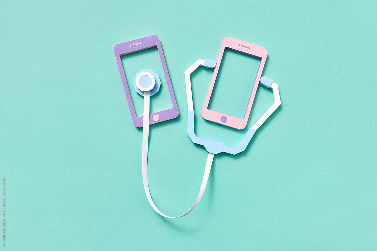 Two smartphones with handmade papercraft stethoscope.