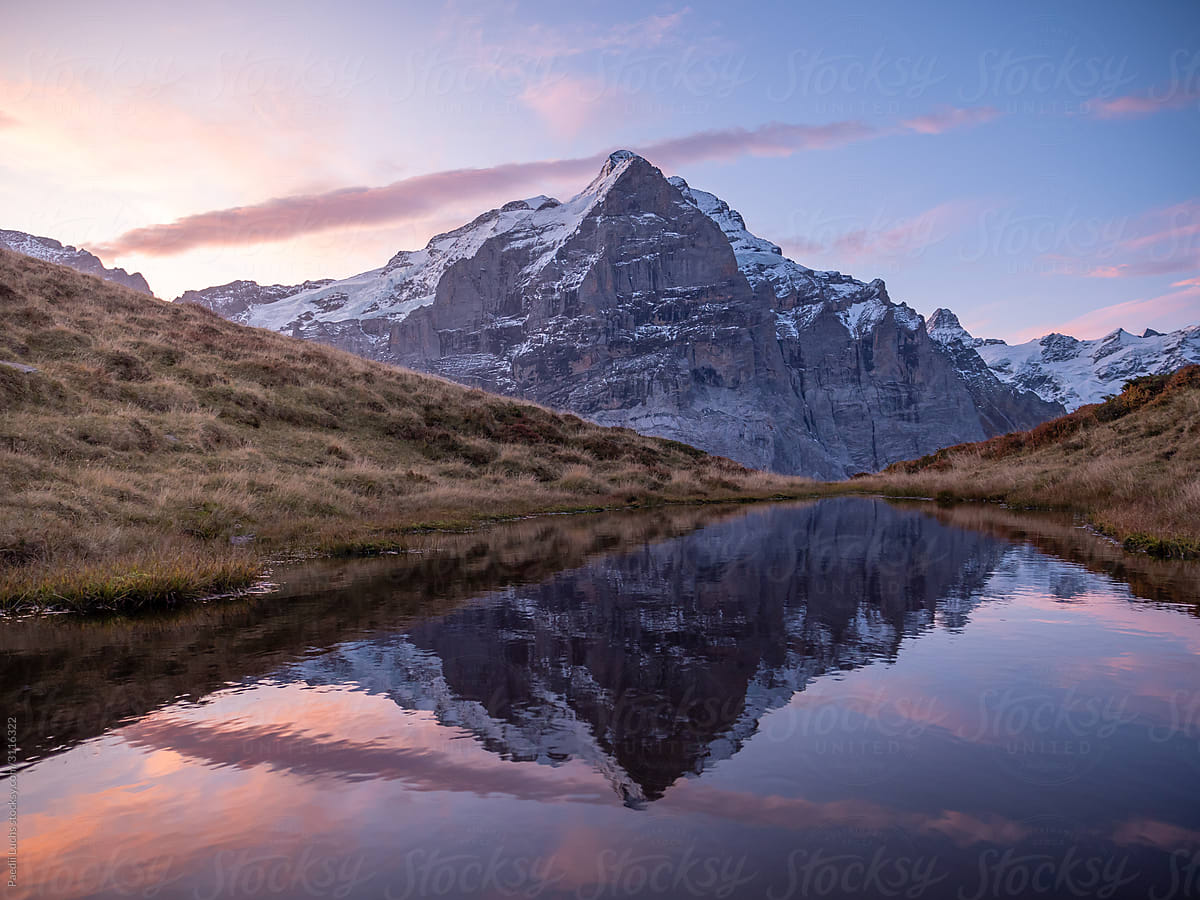 Mountain peak reflecting in alpine lake