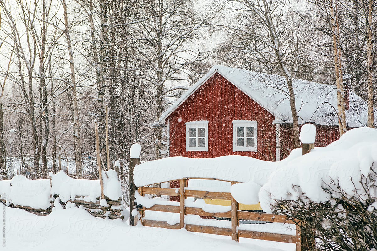 Red Cottage in Snowy Landscape