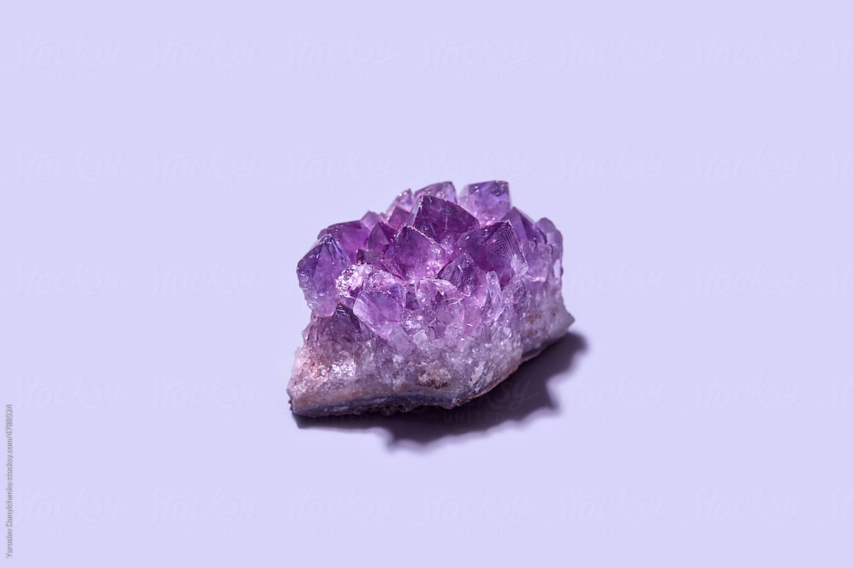 Purple amethyst gemstone with rough surface