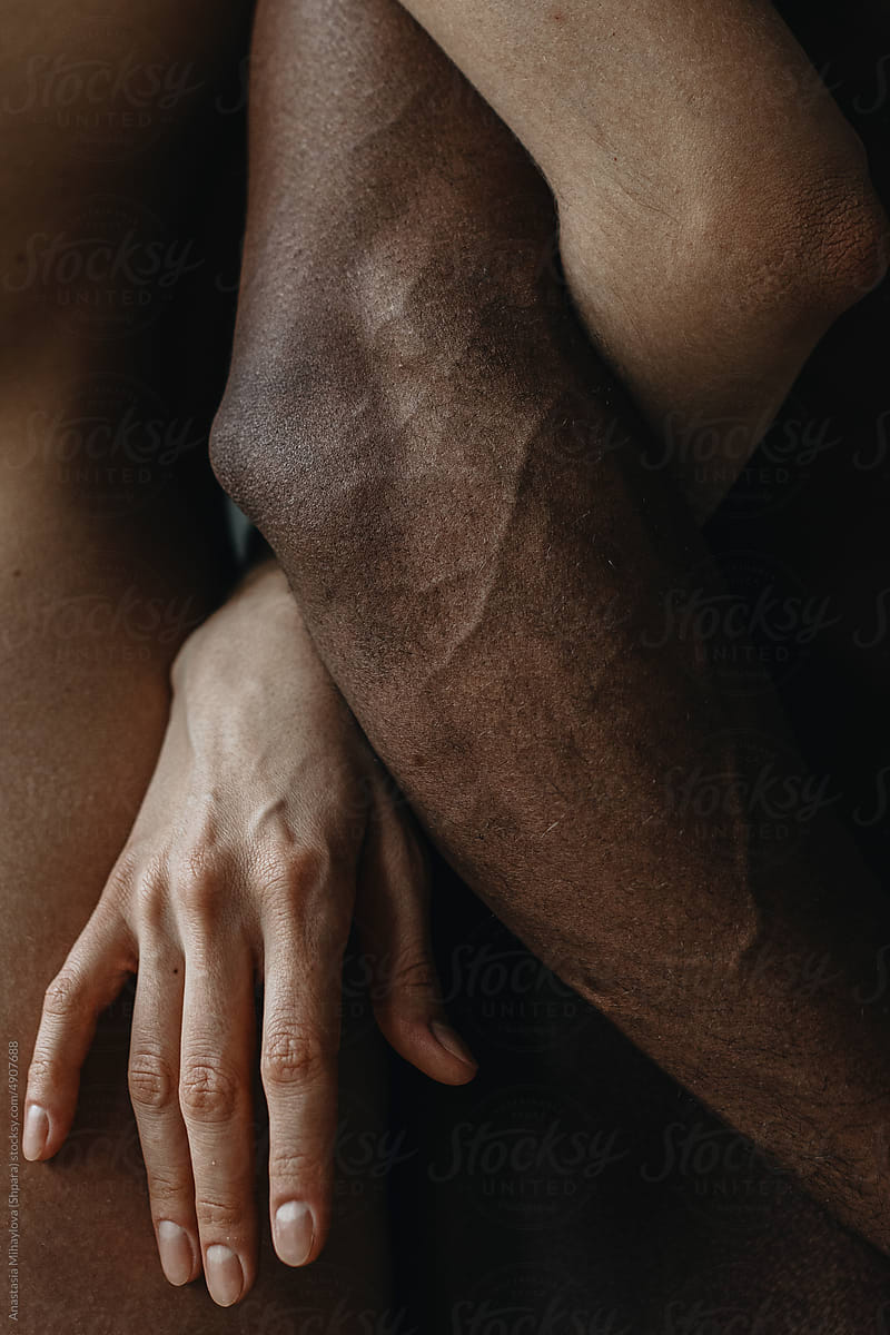 White woman\'s hand holding black man\'s hand, Multiethnic Love Couple
