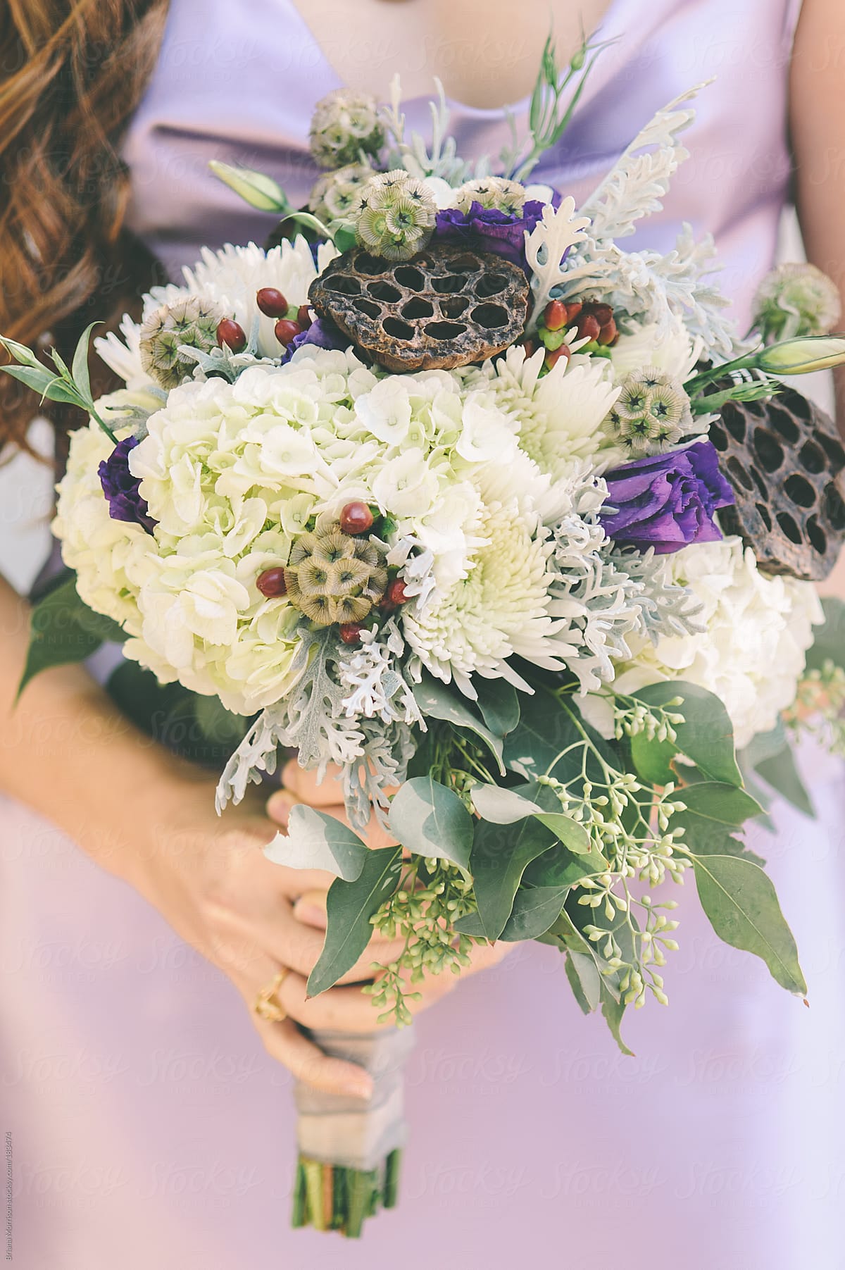 Woman in Purple Dress Holding White and Green Bouquet