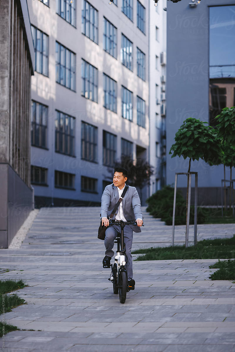 Business person on bike getting to work
