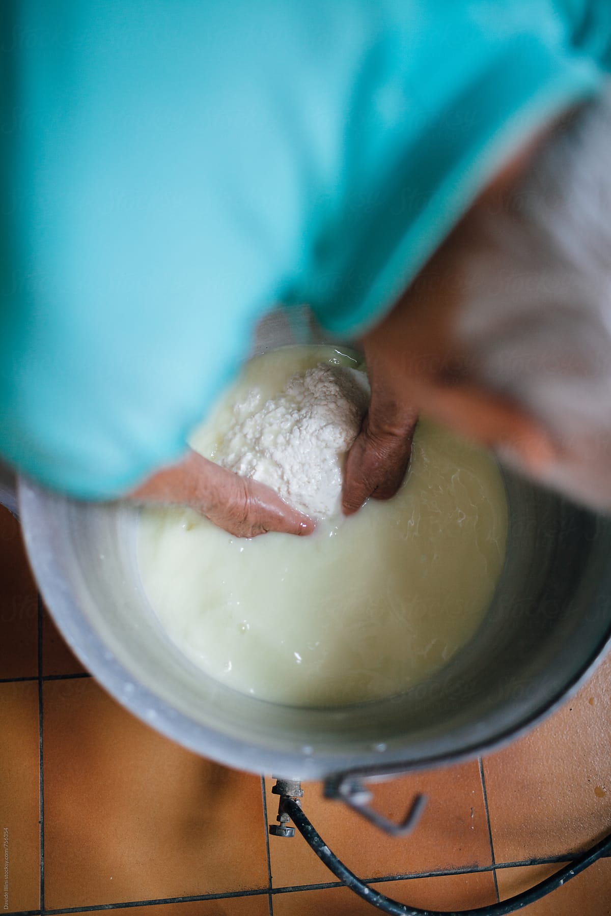 senior-man-making-homemade-cheese-by-stocksy-contributor-davide