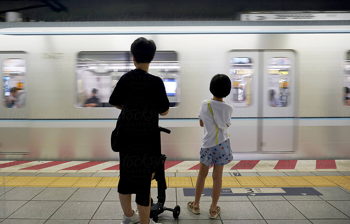 Asian mother and daughter steam waiting for trains